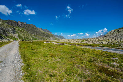 Scenic view of landscape against blue sky