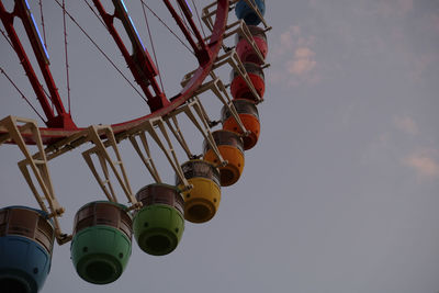 Low angle view of ferris wheel against sky