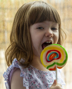 Portrait of cute girl with lollipop 