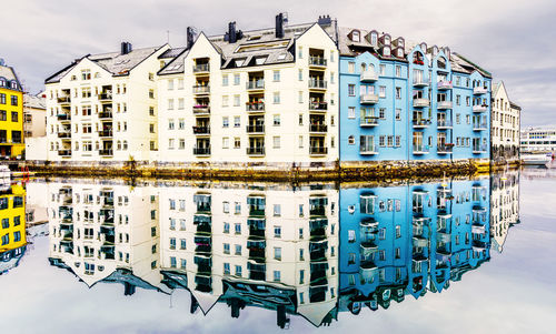 Historic building mirroring in canal