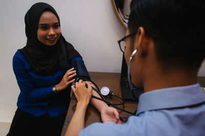 Midsection of woman holding hands