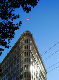 Low angle view of built structure against clear blue sky