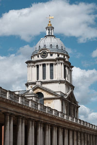 Low angle view of church against cloudy sky