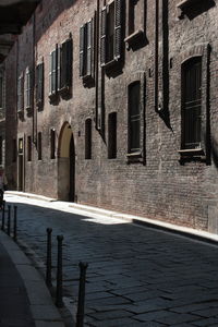 Footpath against old building in town