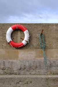 Life belt on stone wall