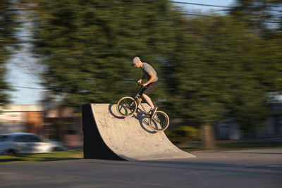 Man riding bicycle on road