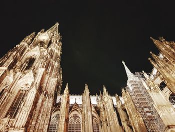 Low angle view of cathedral against sky at night