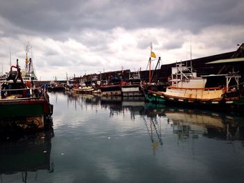 Boats moored at harbor