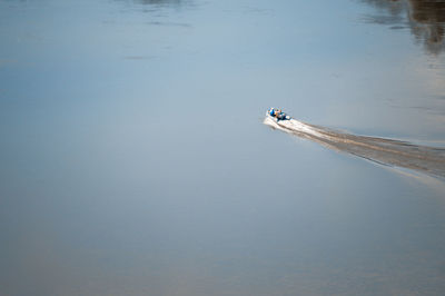 High angle view of boat sailing on lake