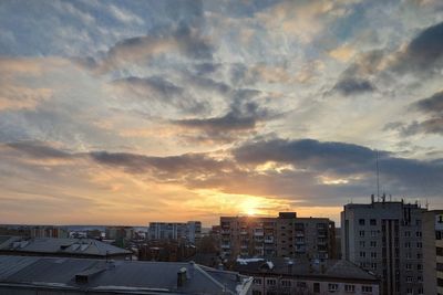 High angle view of buildings against sky during sunset