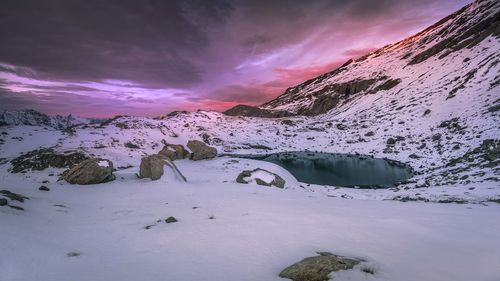 Scenic view of snowcapped mountains against sky during winter