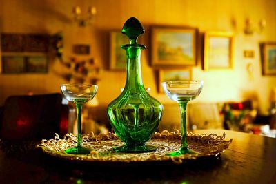 Close-up of wine glasses on table