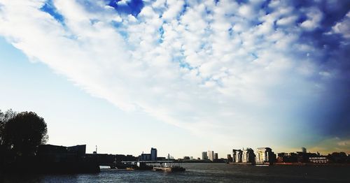 Panoramic view of sea and buildings against sky