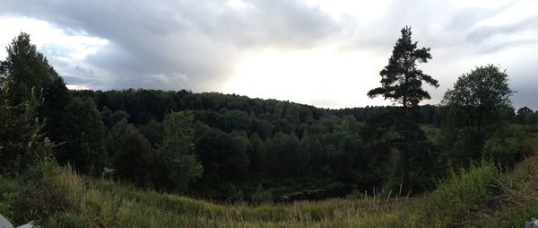 Scenic view of landscape against cloudy sky