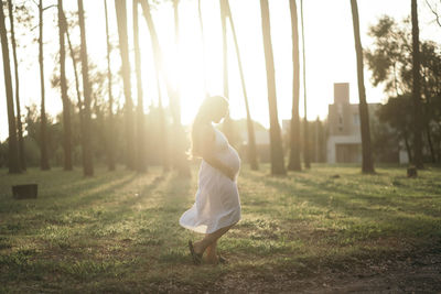 Full length of woman standing on field