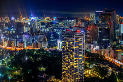 High angle view of illuminated buildings in city at night