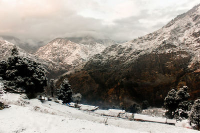 Scenic view of snowcapped mountains against sky