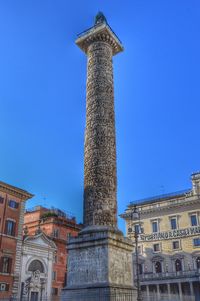 Low angle view of historical building against blue sky