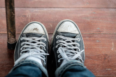 Low section of person wearing canvas shoes