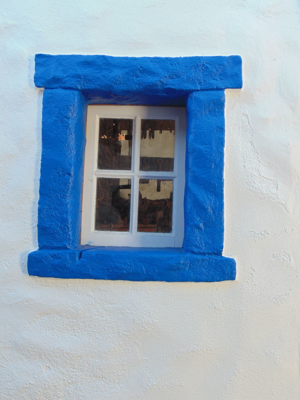 CLOSE-UP OF WINDOW ON WALL