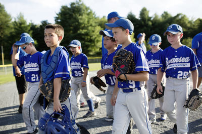 Baseball players walking on field