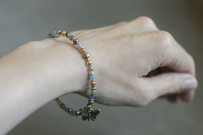 Cropped hand of woman wearing bracelet