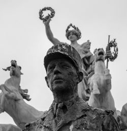 Low angle view of statue against sky