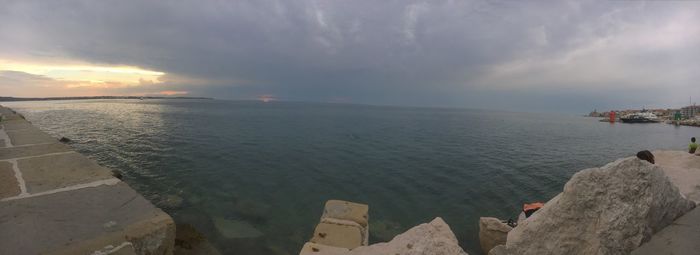 Panoramic view of sea against sky during sunset