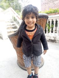 Portrait of smiling girl standing outdoors