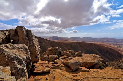 Scenic view of rock formations against sky