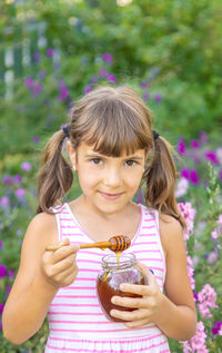 Portrait of cute girl holding apple