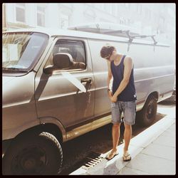 Full length of woman standing by railing