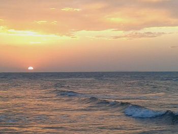 Scenic view of sea at sunset