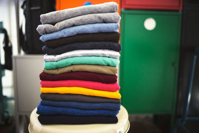 Stack of multi colored clothes at home