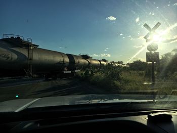 Cars on road against sky