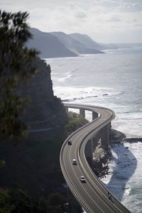 High angle view of road by sea against sky