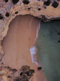 High angle view of rock formations on shore