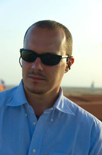 Man wearing sunglasses against clear sky
