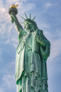 Low angle view of statue against cloudy sky