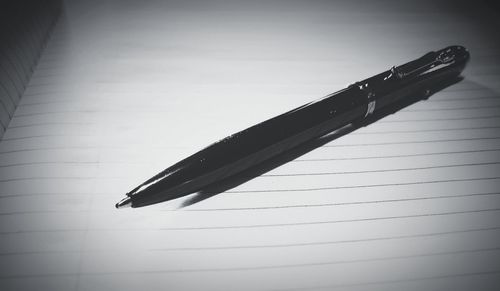 Close-up of pen on table