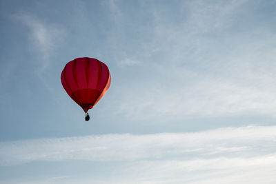 Low angle view of hot air balloon flying in sky