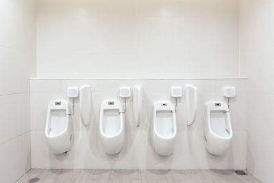 View of urinal in bathroom 