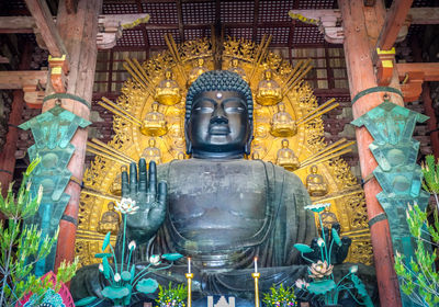 Statue against temple in building