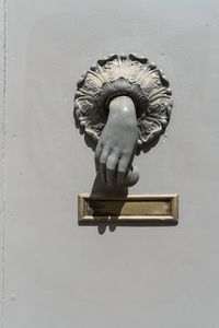 Close-up of statue against door