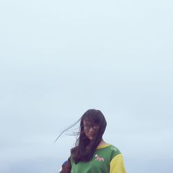 Portrait of woman against sky