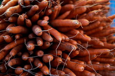 Full frame shot of stacked carrots for sale