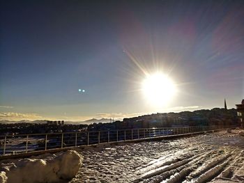 Scenic view of snow against sky during sunset