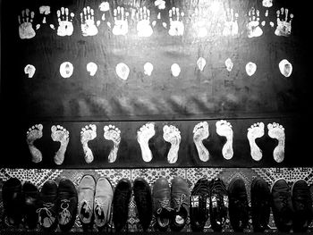 Close-up of illuminated shoes hanging at night