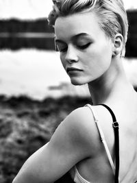 Portrait of young woman looking away