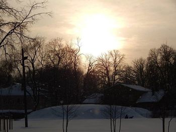 Snow covered landscape at sunset